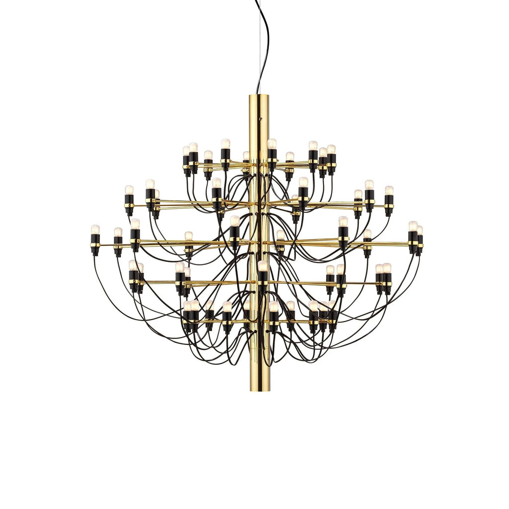 A large Clérachic chandelier with a polished gold stem, many slim arms and looping black cables, on a white backdrop.