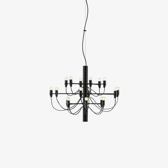 A compact Clérachic chandelier in matt black with slim looping arms and exposed bulbs, on a pale grey backdrop.