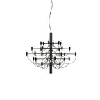 A mid-size Clérachic chandelier in matt black, with tiers of slim arms around a short central stem, on white.
