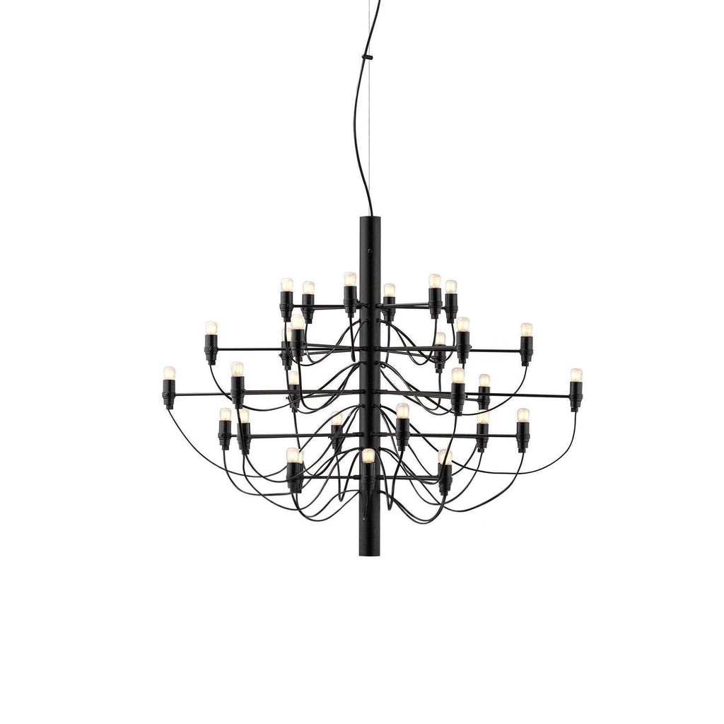 A compact Clérachic tiered chandelier in matt black, with three tiers of slim arms and exposed bulbs, on a white backdrop.