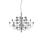 A compact Clérachic chandelier with a chrome stem and slim arms, its exposed bulbs and looping cables shown on white.