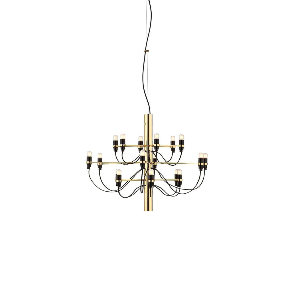 A small Clérachic chandelier with a polished gold stem and two tiers of slim arms ending in exposed bulbs, on white.