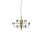 A small Clérachic chandelier with a polished gold stem and two tiers of slim arms ending in exposed bulbs, on white.