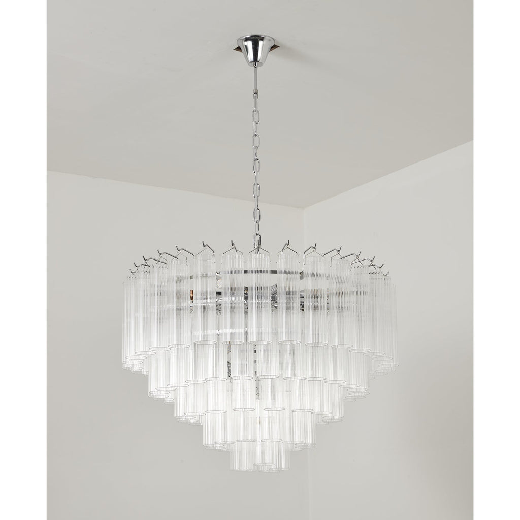 Clérachic chandelier in a chrome finish, unlit, its widest tier of glass rods spreading beneath a long chain.