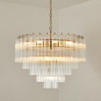 Close view of the upper tiers of this Clérachic chandelier, lit, with the long glass rods and small hooks along the rim.