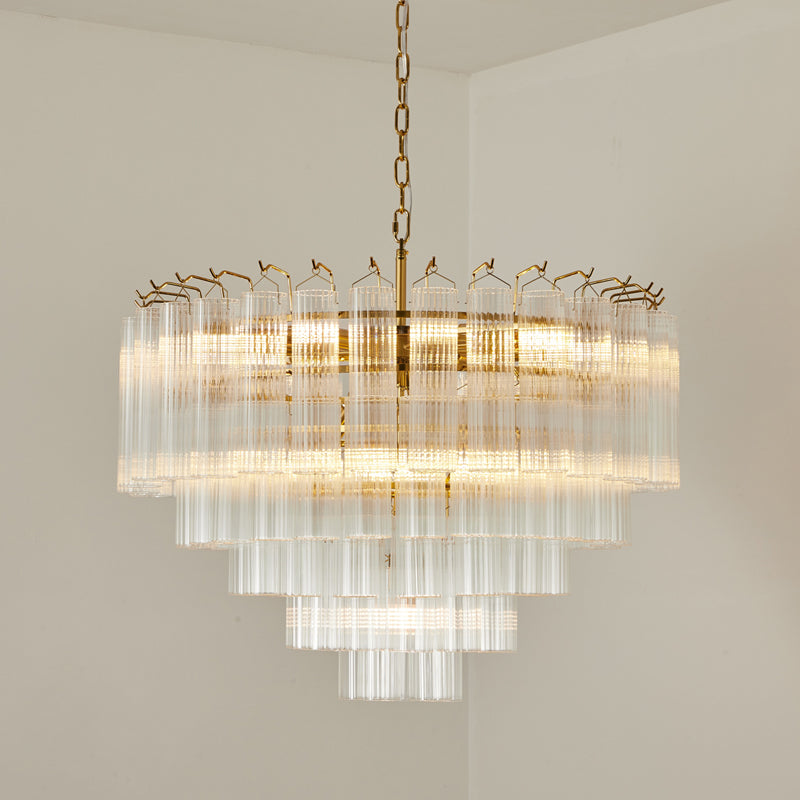 Close view of the upper tiers of this Clérachic chandelier, lit, with the long glass rods and small hooks along the rim.