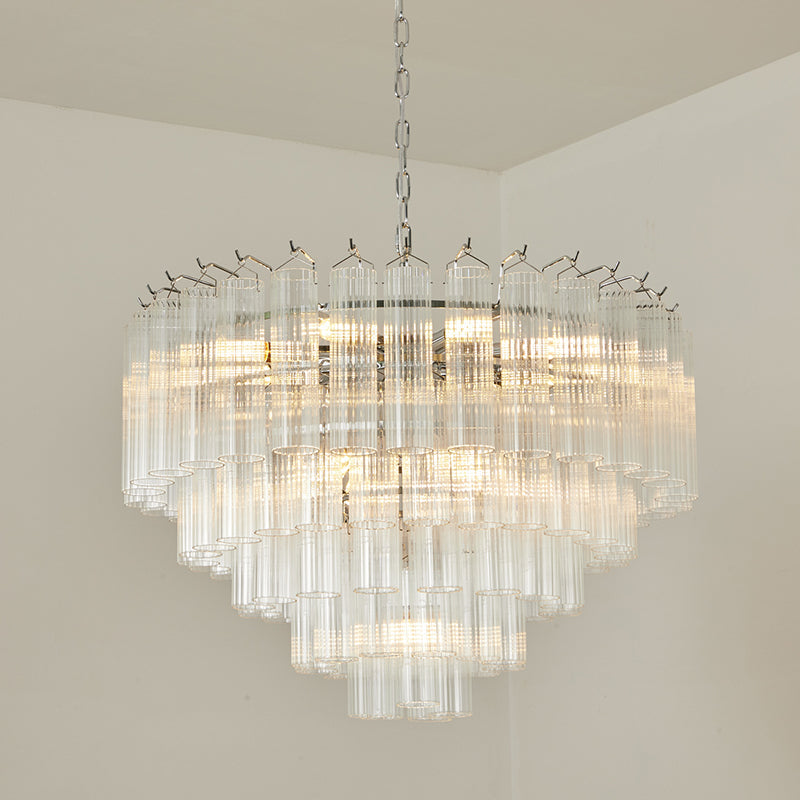 Clérachic chandelier with a chrome chain, lit, its broad tiers of clear glass rods reaching out from the centre.