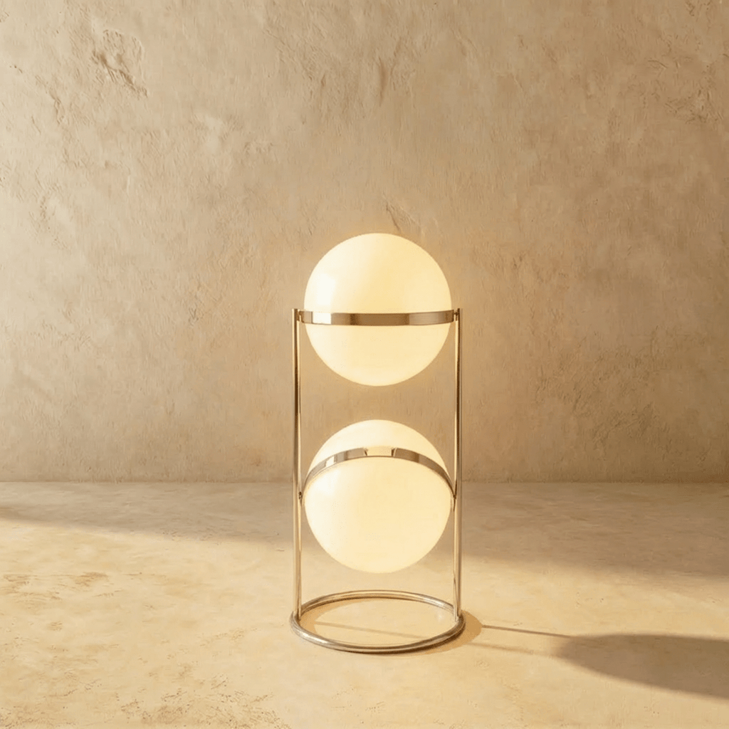 Clérachic two-globe sphere lamp in silver, both globes lit on a slim frame that stands on a closed ring base.