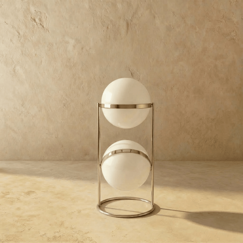 Clérachic two-globe sphere lamp in silver, shown unlit, the white globes carrying a single hard highlight from the studio light.