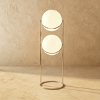 Clérachic two-globe sphere lamp in silver on the taller column, the uprights running well below the lower globe to the ring base.