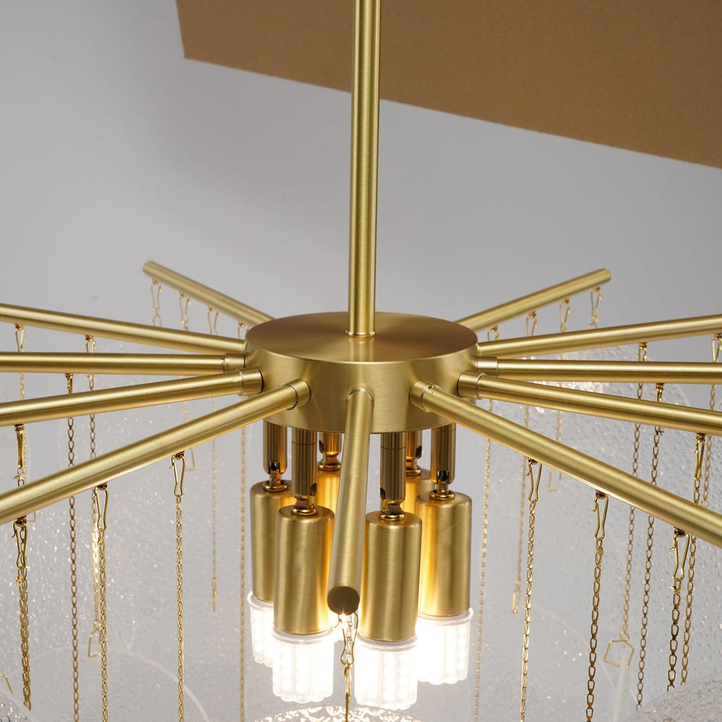 Underside view of the brass hub on this Clérachic chandelier, with the bulbs and the hanging chains holding the discs.