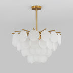 Unlit Clérachic chandelier of overlapping frosted discs on a grey backdrop, with a short brass rod above.