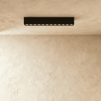 Clérachic long grille head in black, its twelve lenses dark, seen straight on from below.