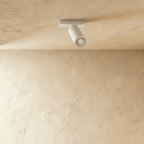 Clérachic single spotlight head in white, its barrel turned down from a short ceiling bar.
