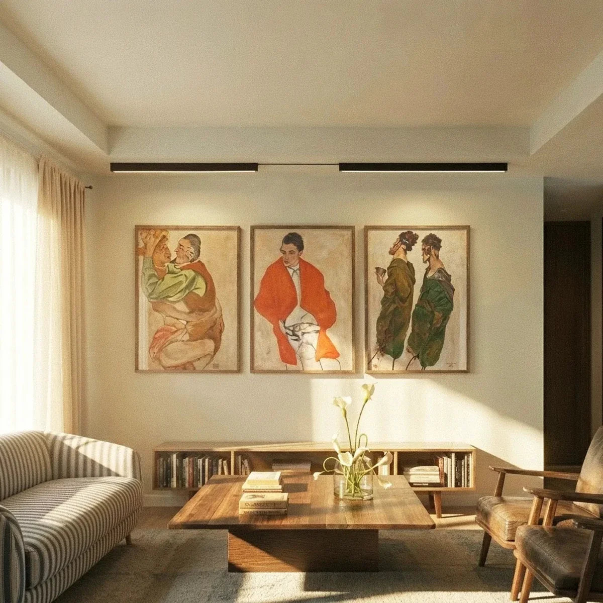 Clérachic linear light heads in black, two lit on one ceiling rail above three framed artworks.