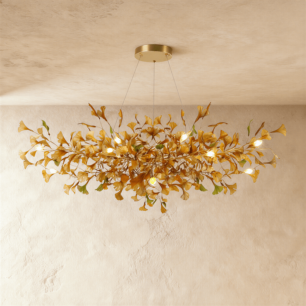 Clérachic's chandelier in its round form, amber glass leaves clustered densely around a brass frame.