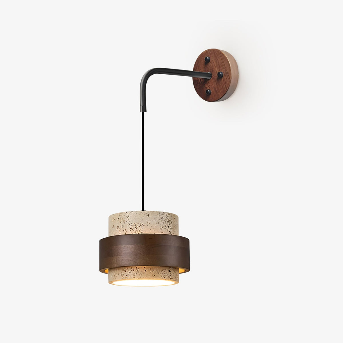 A Clérachic wall light on a plain pale backdrop, with a black arm, round walnut plate and a travertine shade ringed in dark walnut.