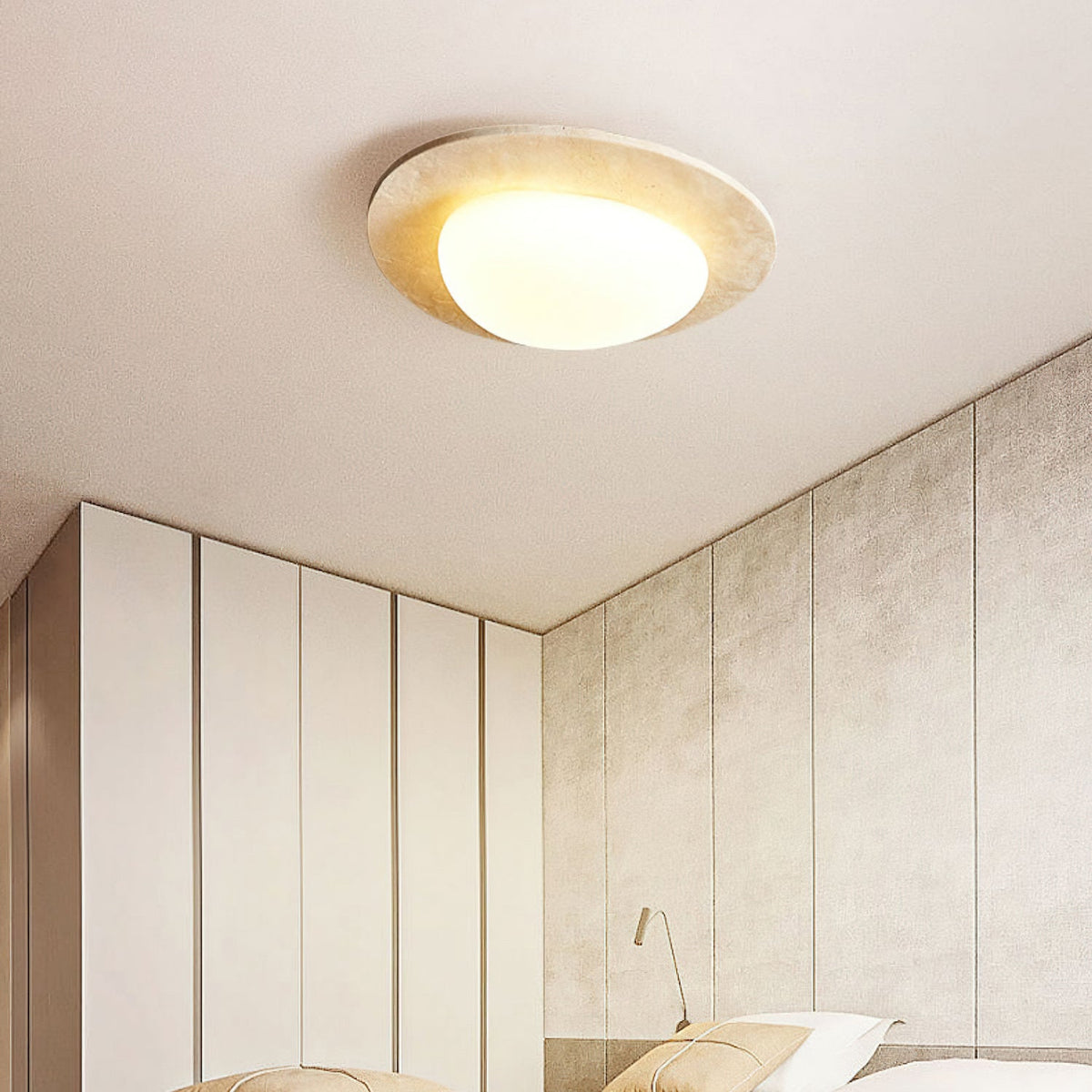 Ceiling light from Clérachic in a corner of a room with white wardrobe doors and textured stone-effect wall panels, softly lit.