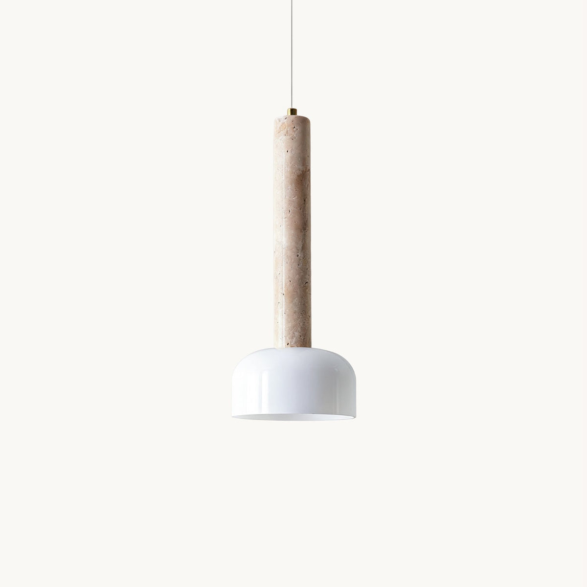 A Clérachic pendant light on a plain white backdrop, a slim beige travertine column ending in a glossy white half-dome shade.