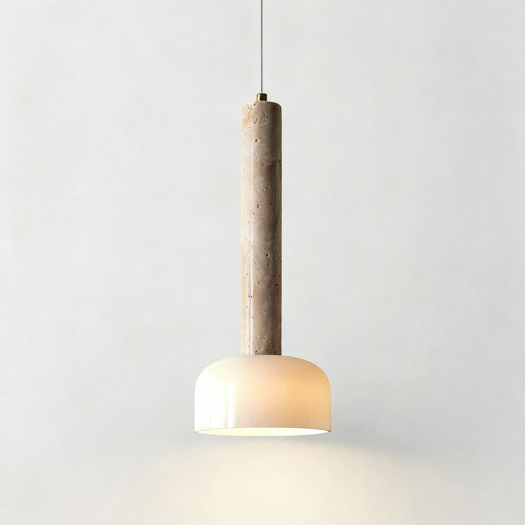 Lit from within, this Clérachic pendant light shows its travertine stem with natural pores above a softly glowing white dome.