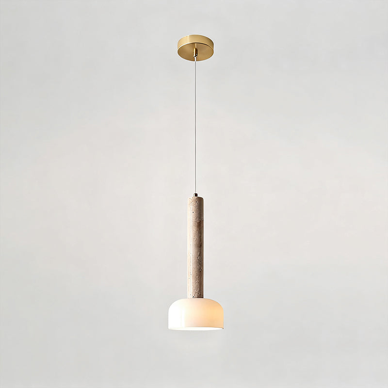 This Clérachic pendant light hangs from a round gold ceiling plate on a fine cord, with the stone stem above a glowing dome.