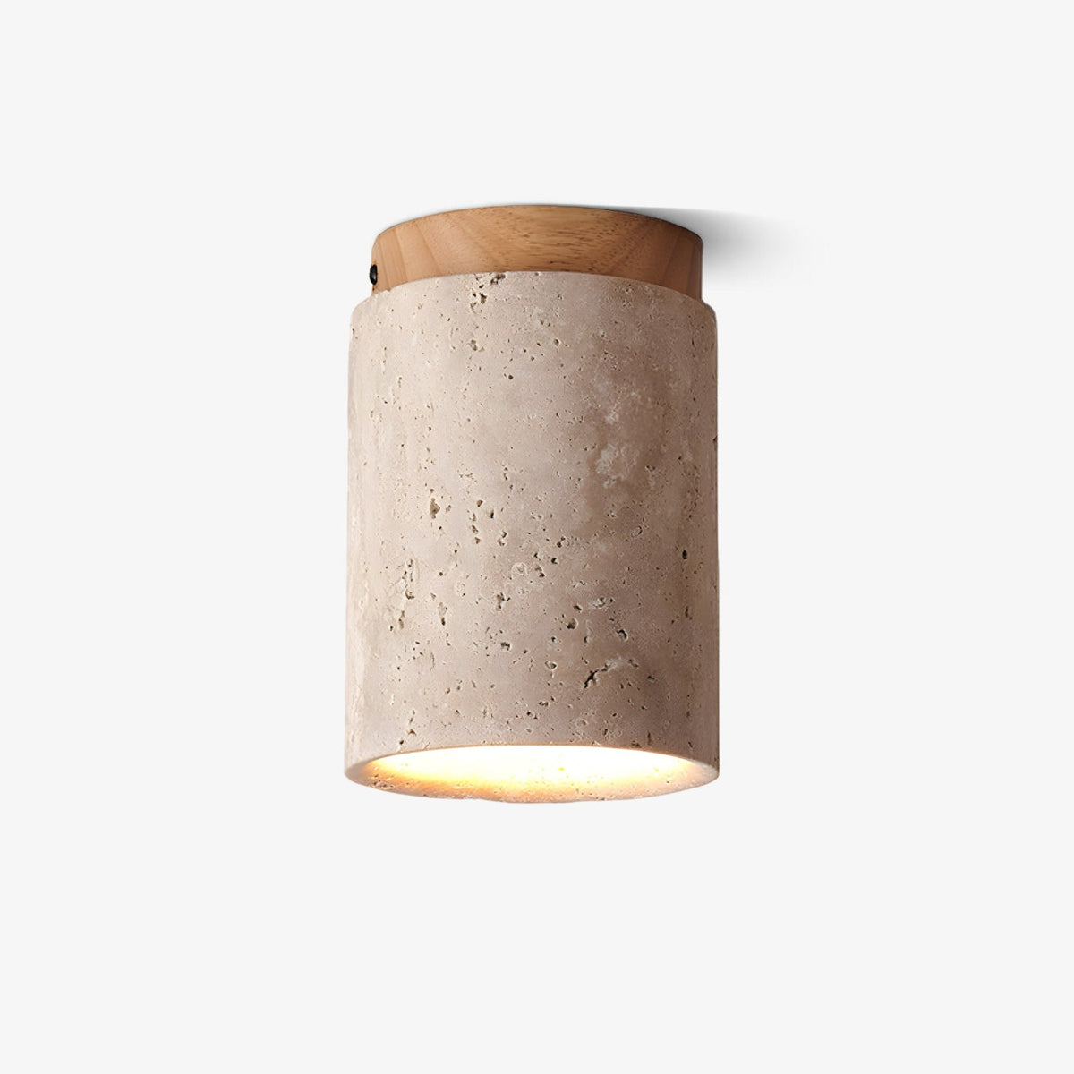 Clérachic ceiling light on a plain white backdrop, a travertine cylinder with a pale wood cap and a warm glow at its open base.