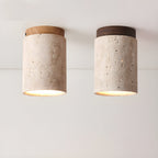 Two Clérachic ceiling lights side by side, one with a wood-colour cap and one with a walnut cap, both lit.