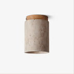 Unlit Clérachic ceiling light on a pale grey backdrop, a stone cylinder under a light wood cap with a small screw at the side.