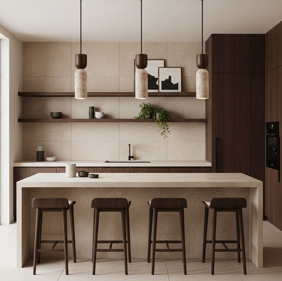Three small Clérachic travertine pendants in a beige kitchen with dark wood cabinets, shelves and a long island with four stools.