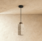 This square travertine pendant from Clérachic shows its warm stone veining and dark wood cap in a close hero view.