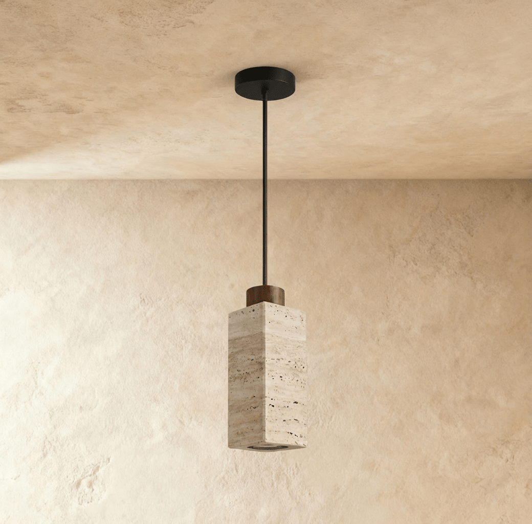 This square travertine pendant from Clérachic shows its warm stone veining and dark wood cap in a close hero view.