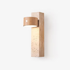 Clérachic wall light with a natural wood round head on a tall Yellow Travertine block, shown on a plain white backdrop.