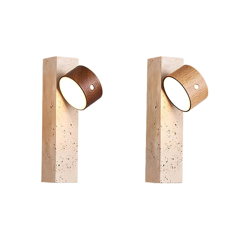 Two Clérachic travertine wall lights, one with its walnut head facing down and one tilted outward, on a plain white backdrop.