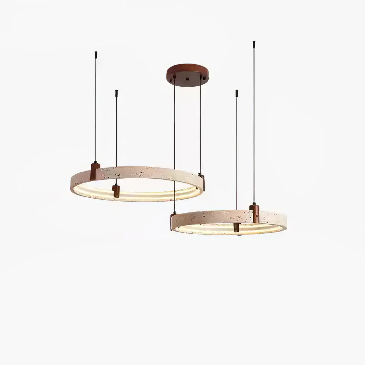 Two travertine rings at different heights, from a Clérachic pendant, with a warm strip of light inside each ring and a white backdrop.