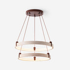 Studio shot of a Clérachic two-tier travertine pendant, two rings stacked on angled brown cords from a round canopy, on white.