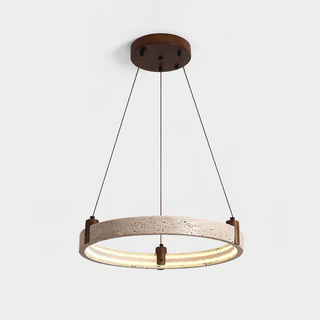 Warm light runs around the inner edge of this Clérachic travertine ring pendant, which hangs on cords from a round canopy, on light grey.