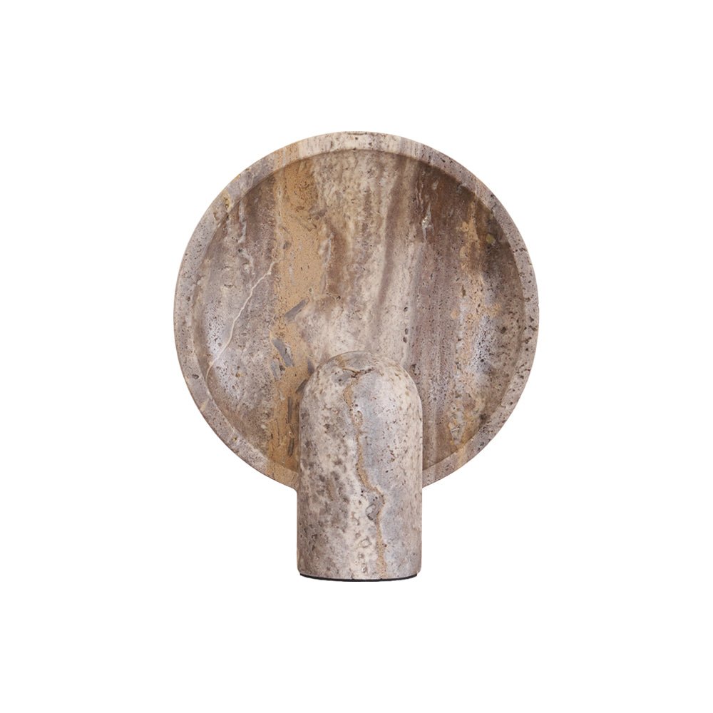 The unlit Clérachic travertine lamp cut out on a white ground, the shallow disc streaked in cream, tan and grey.