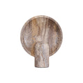 The unlit Clérachic travertine lamp cut out on a white ground, the shallow disc streaked in cream, tan and grey.