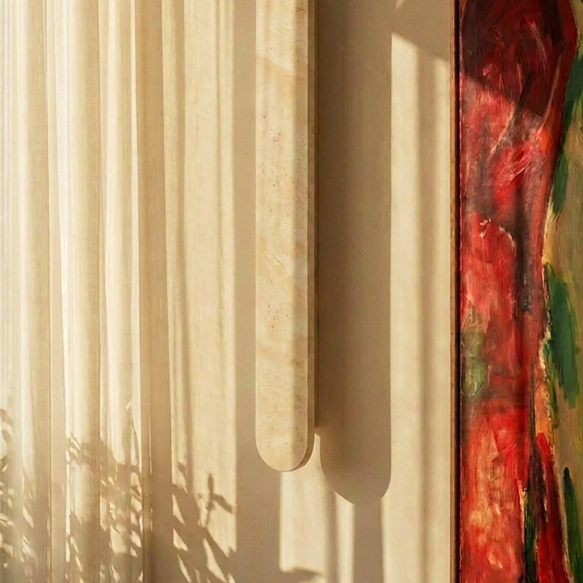 Clérachic cream travertine wall light close up, with its rounded end and stone grain catching sunlight beside a sheer curtain.
