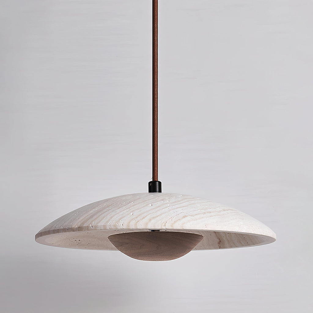 Clérachic pendant in veined travertine with a dark walnut-toned bowl beneath, shown unlit on a grey backdrop.