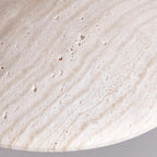 Close view of the pitted, banded travertine surface on this Clérachic pendant's shade.