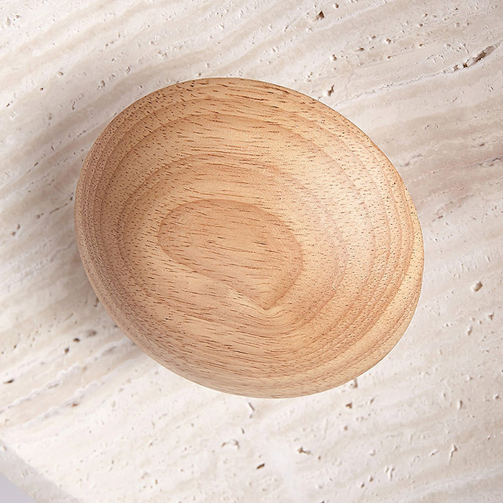 Close view of the grain of the light wood bowl beneath this Clérachic pendant, seen against the stone shade.