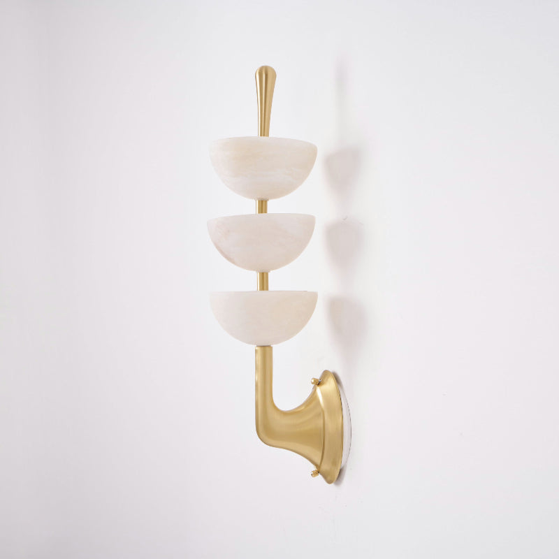Clérachic triple-dome wall sconce in brushed brass, three alabaster half-domes stacked up a slim rod, shown unlit on white.