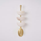 Full-length studio shot of the Clérachic alabaster wall sconce, each bowl seated on its own brass collar up the central rod.