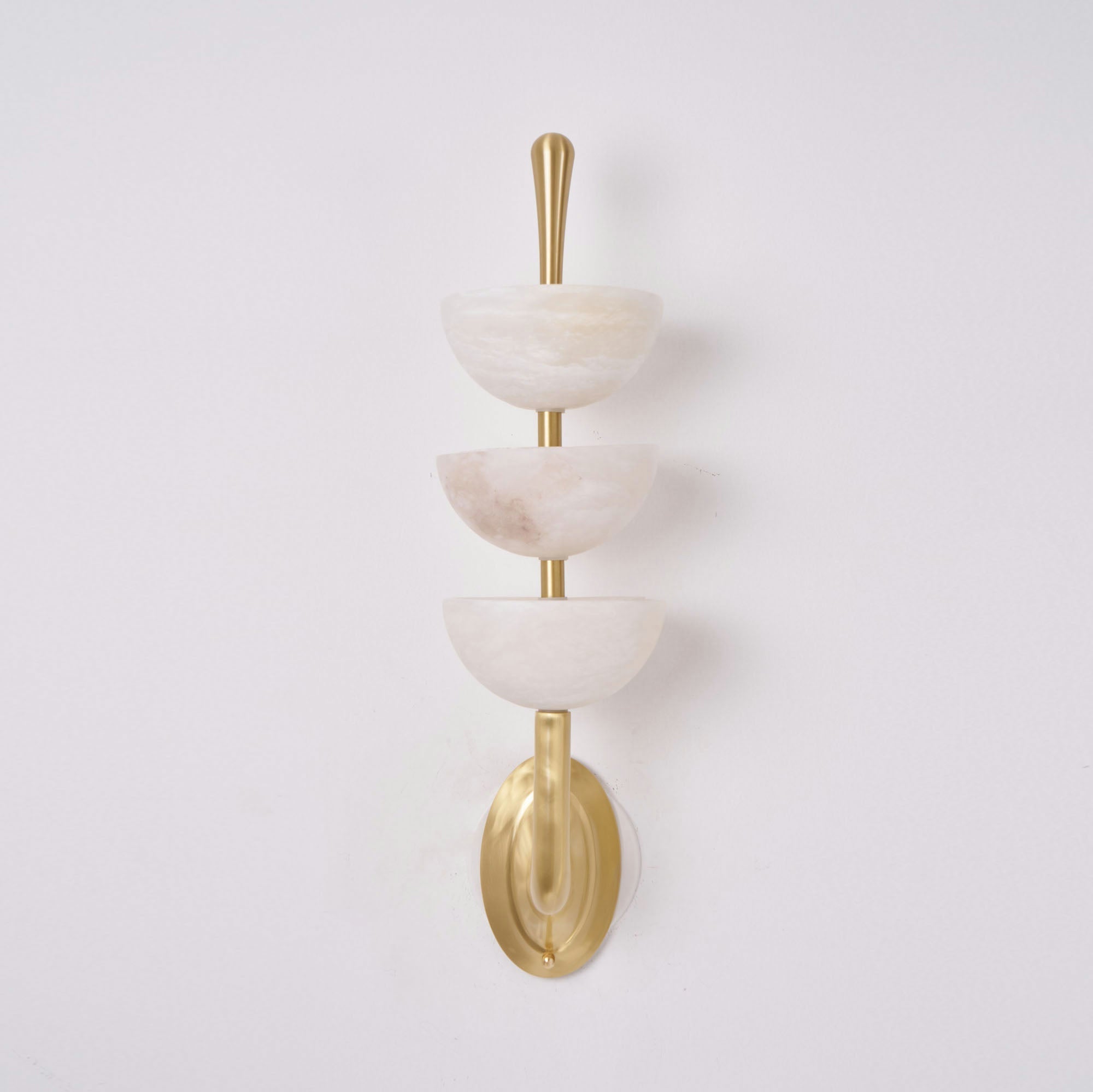Full-length studio shot of the Clérachic alabaster wall sconce, each bowl seated on its own brass collar up the central rod.