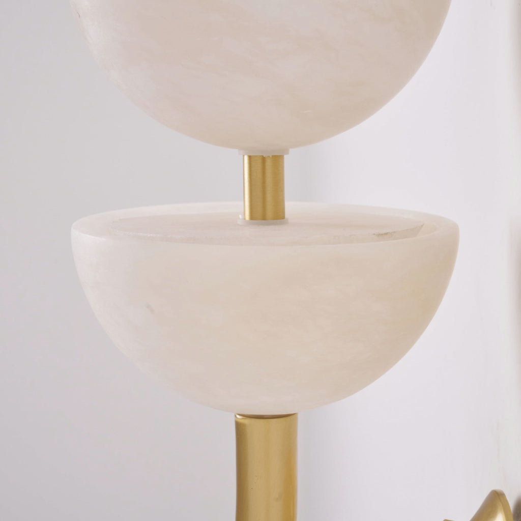 Detail of two alabaster bowls on the Clérachic wall sconce, joined by a short brushed brass collar between the stone rims.