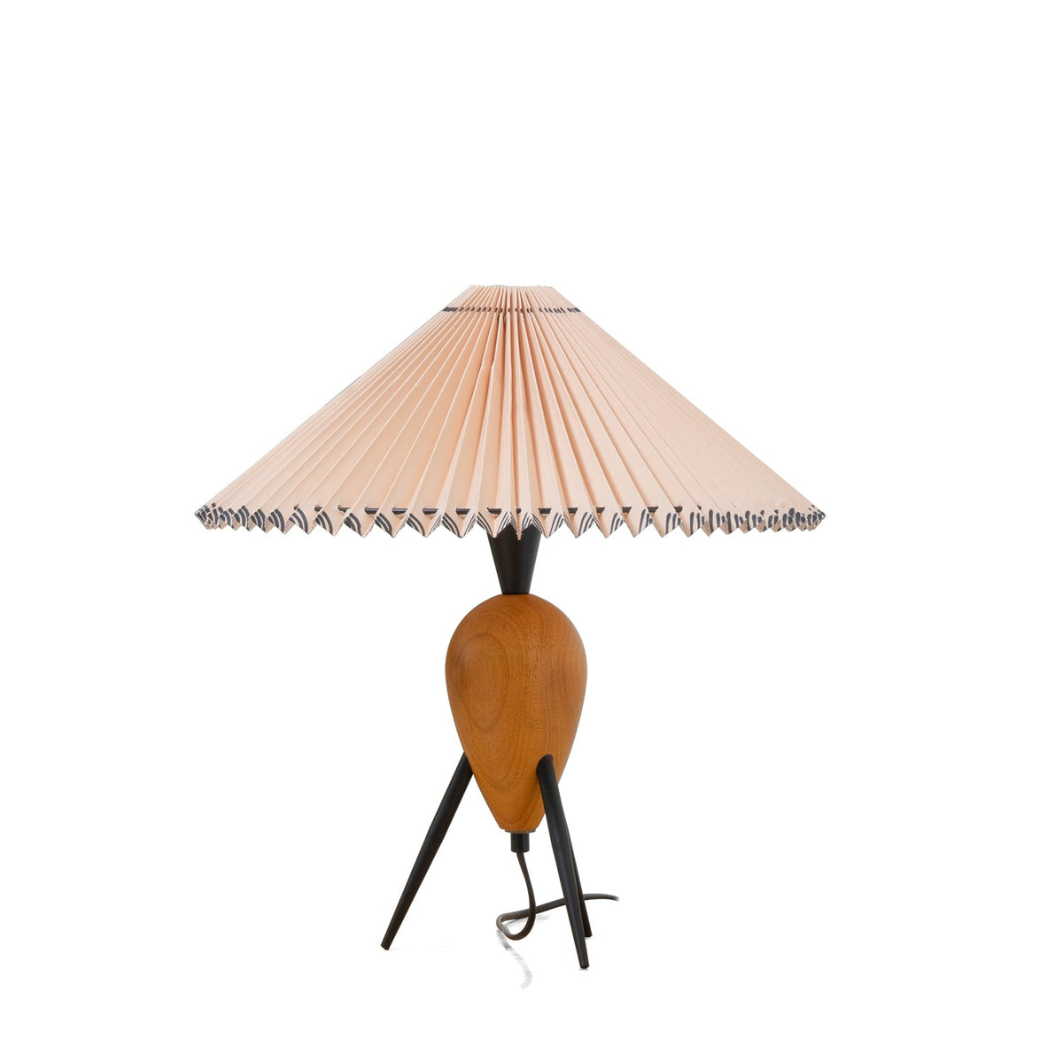 Cut-out Clérachic table lamp on white, shown at a slight angle with its black cord looped on the floor by one leg.