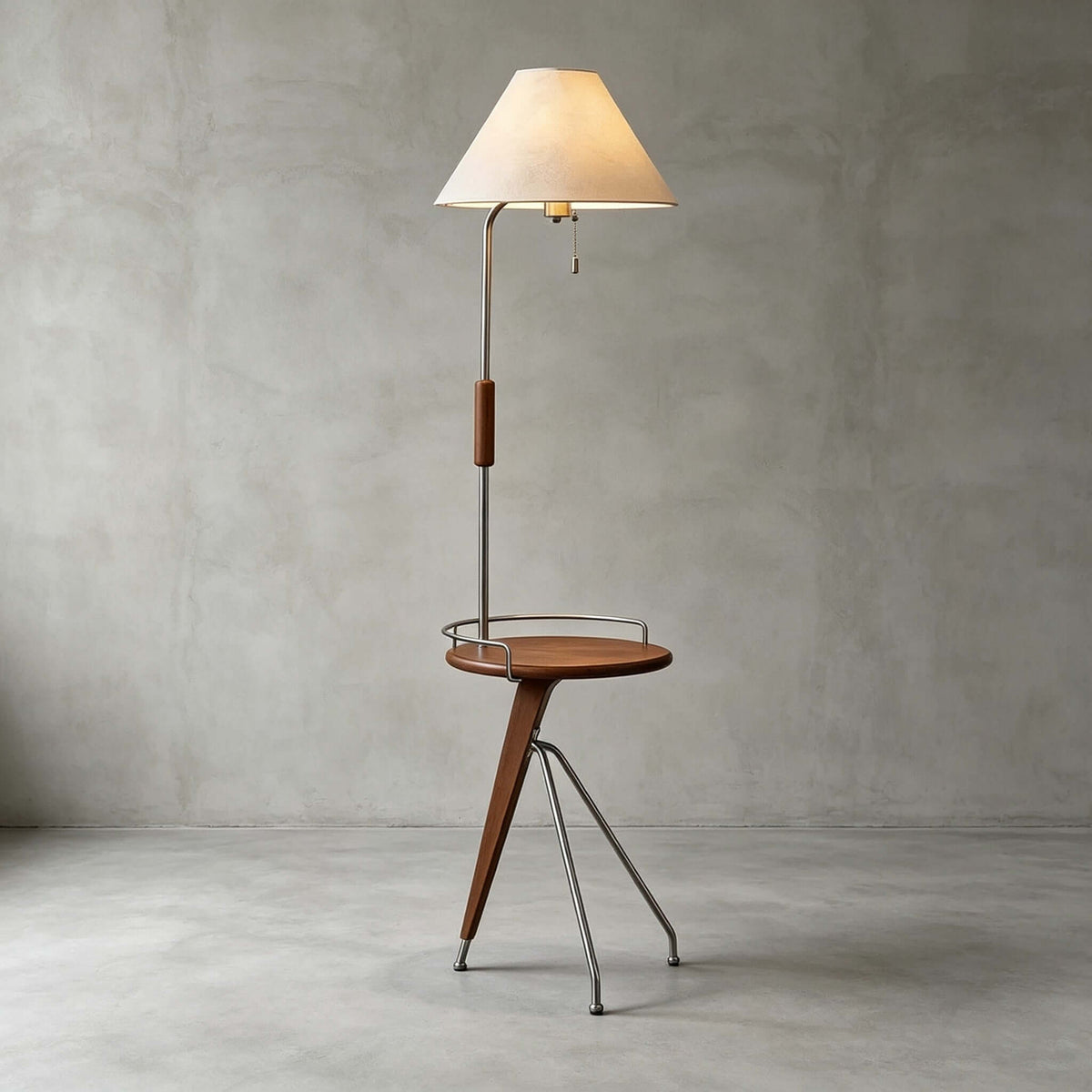 A Clérachic floor lamp with a beige shade and walnut tray table on a polished concrete floor against a grey wall.