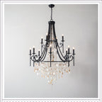 Clérachic Trove in black, its scrolled ironwork carrying a dense cascade of alabaster and clear crystal beads.
