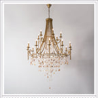 The Clérachic Trove in brass at a wider size, the lower ring flaring out over a long alabaster fringe.